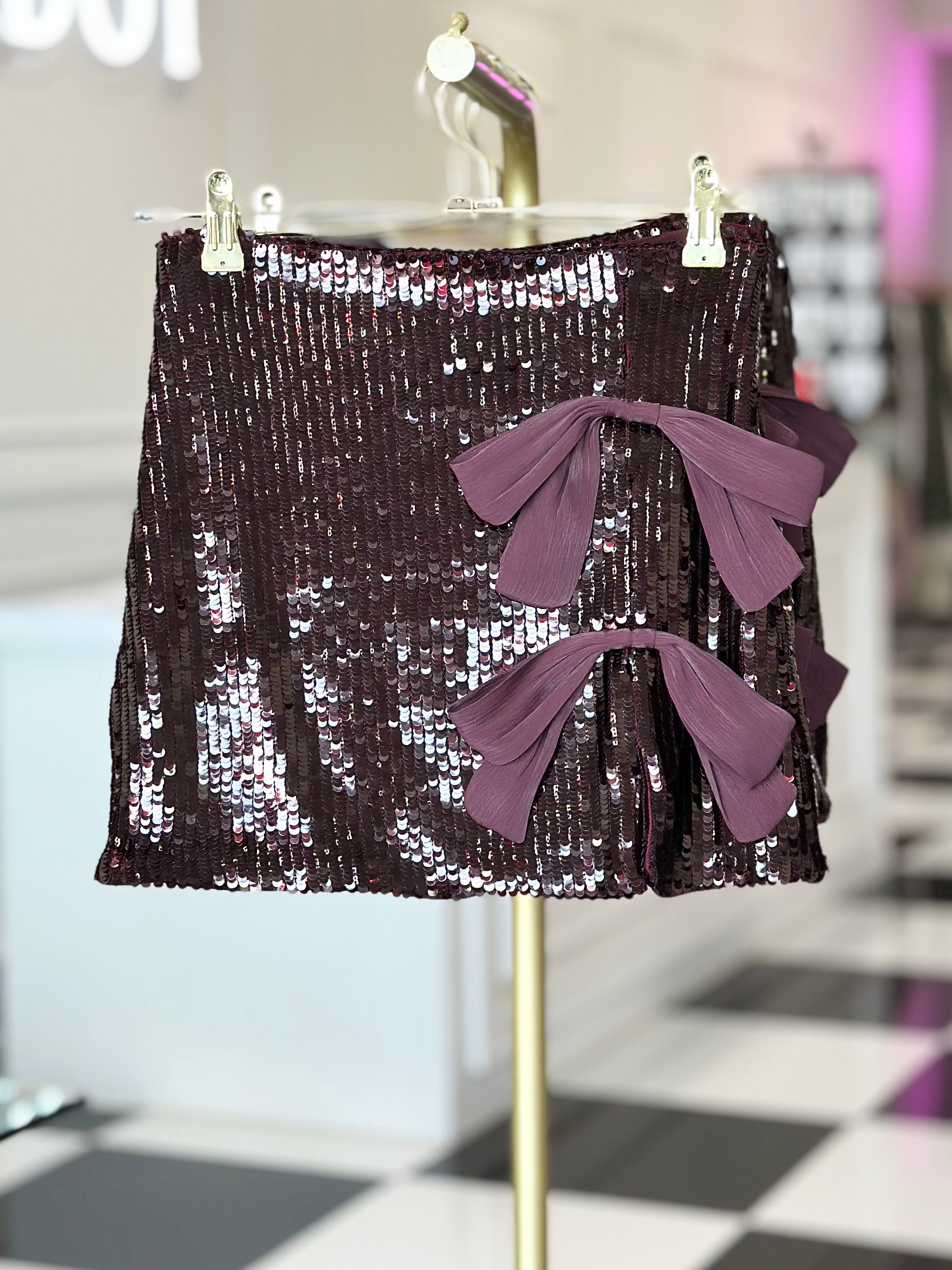 BLAKE BOW DETAIL SEQUIN MINI SKIRT